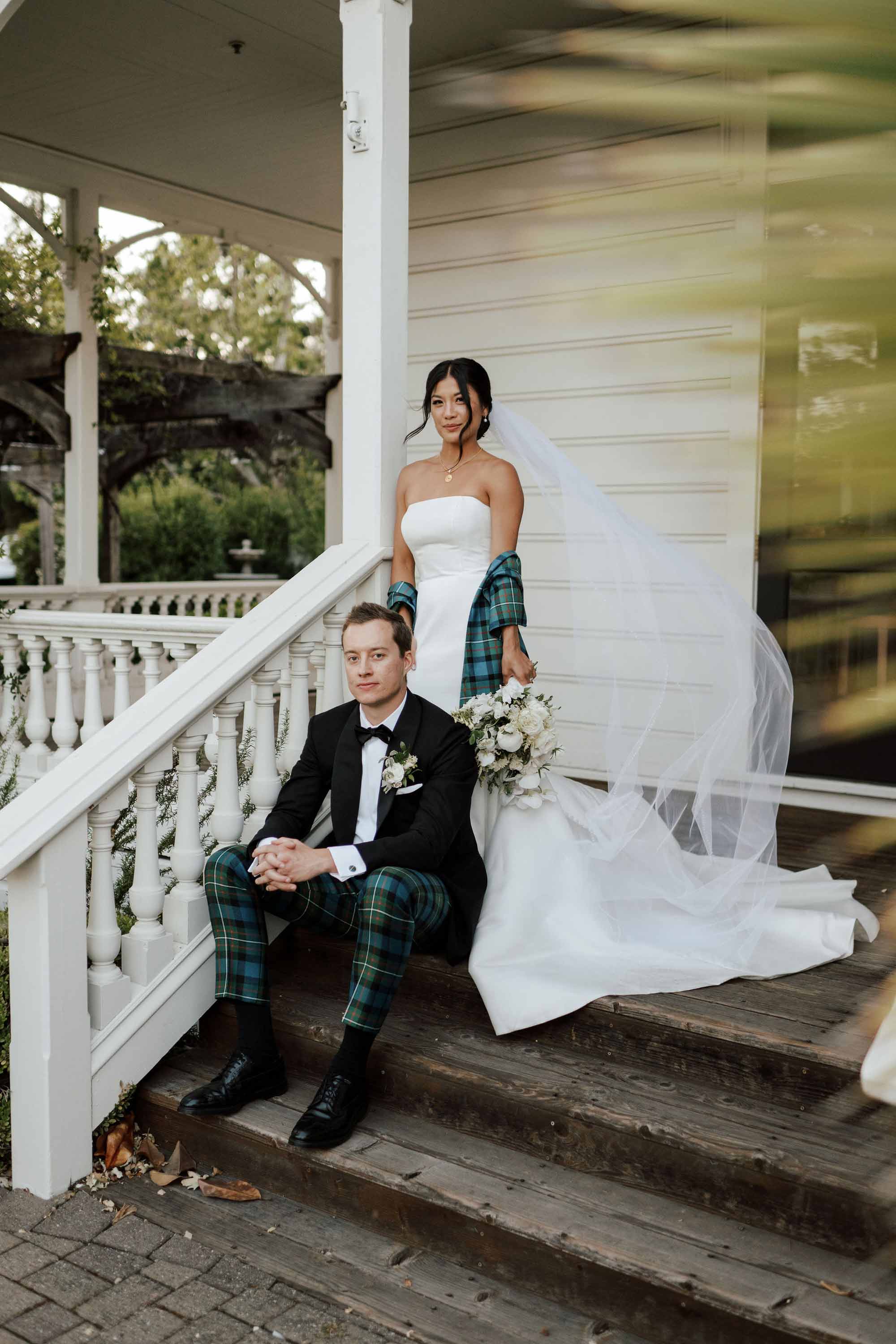 couple sitting on the stairs of the balcony in the generals daughter venue