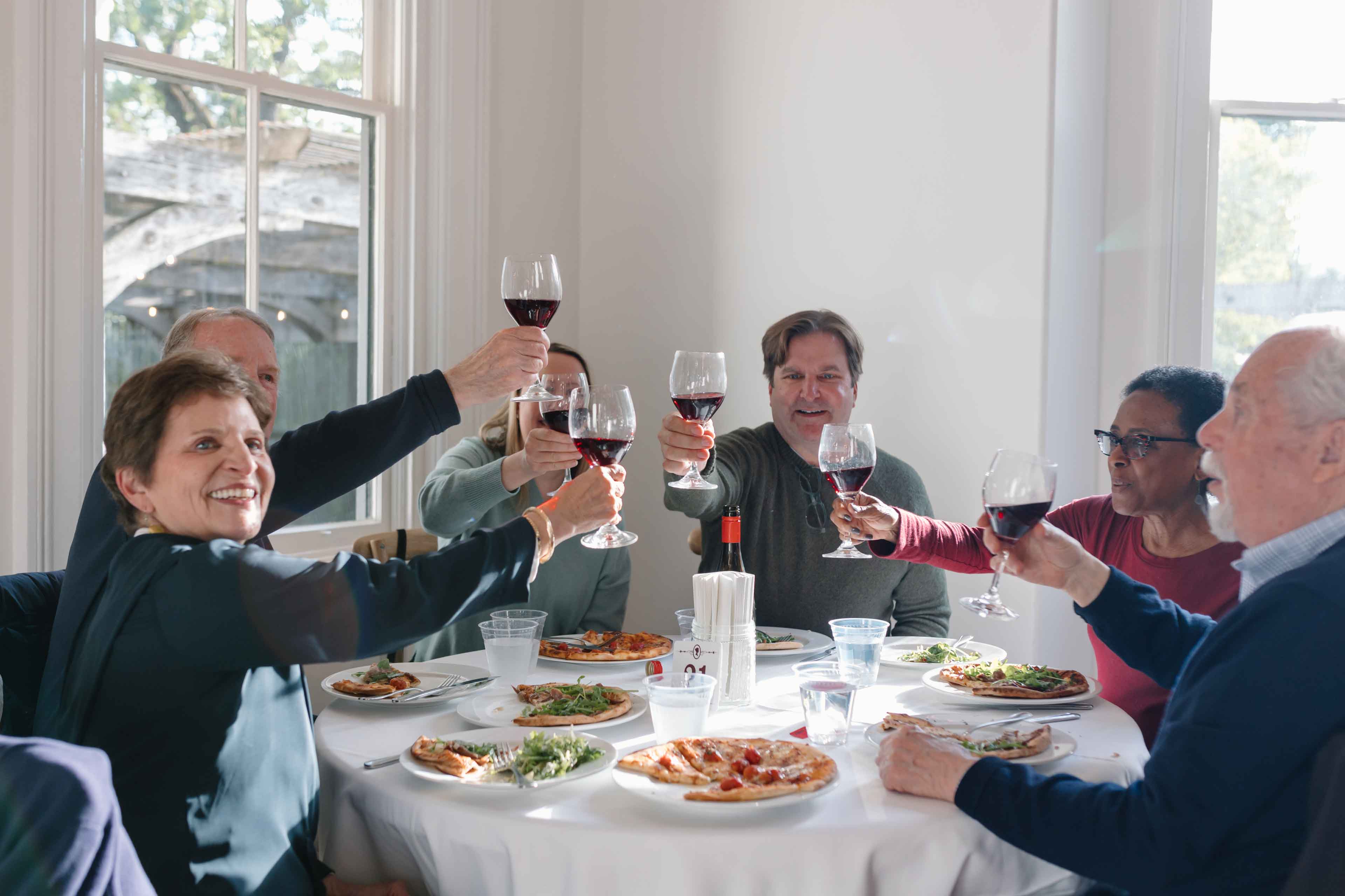people enjoying their pizza and wine at pizza and pinot sonoma