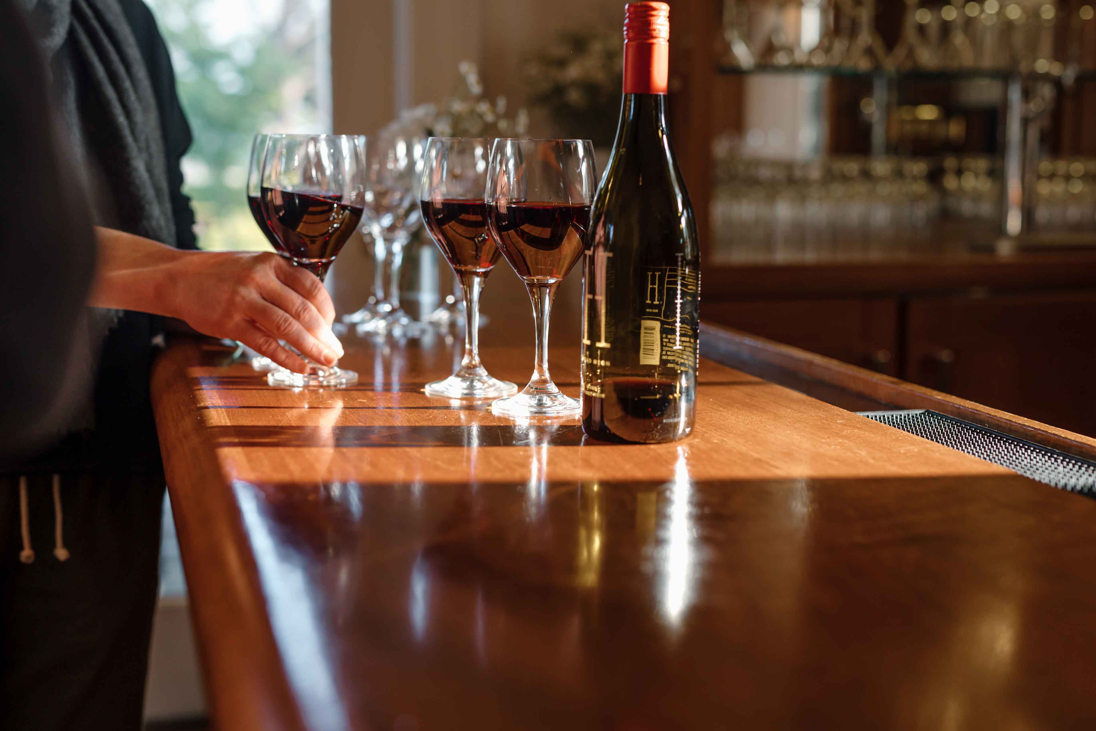 pinot wine glasses on the bar of the generals daughter