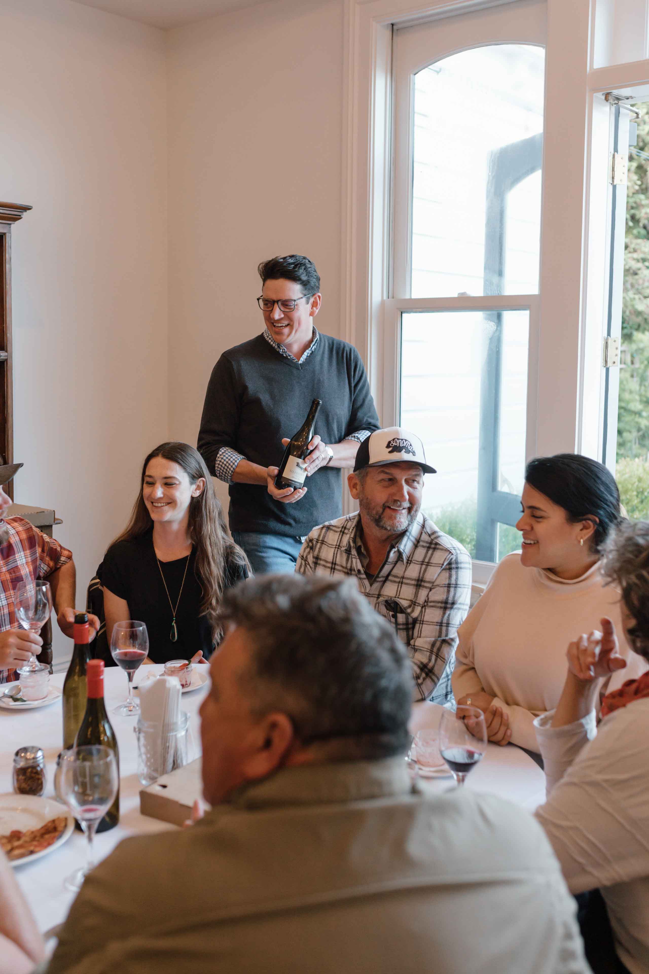 sommelier todd jolly talking about wine to the pizza and pinot event participants